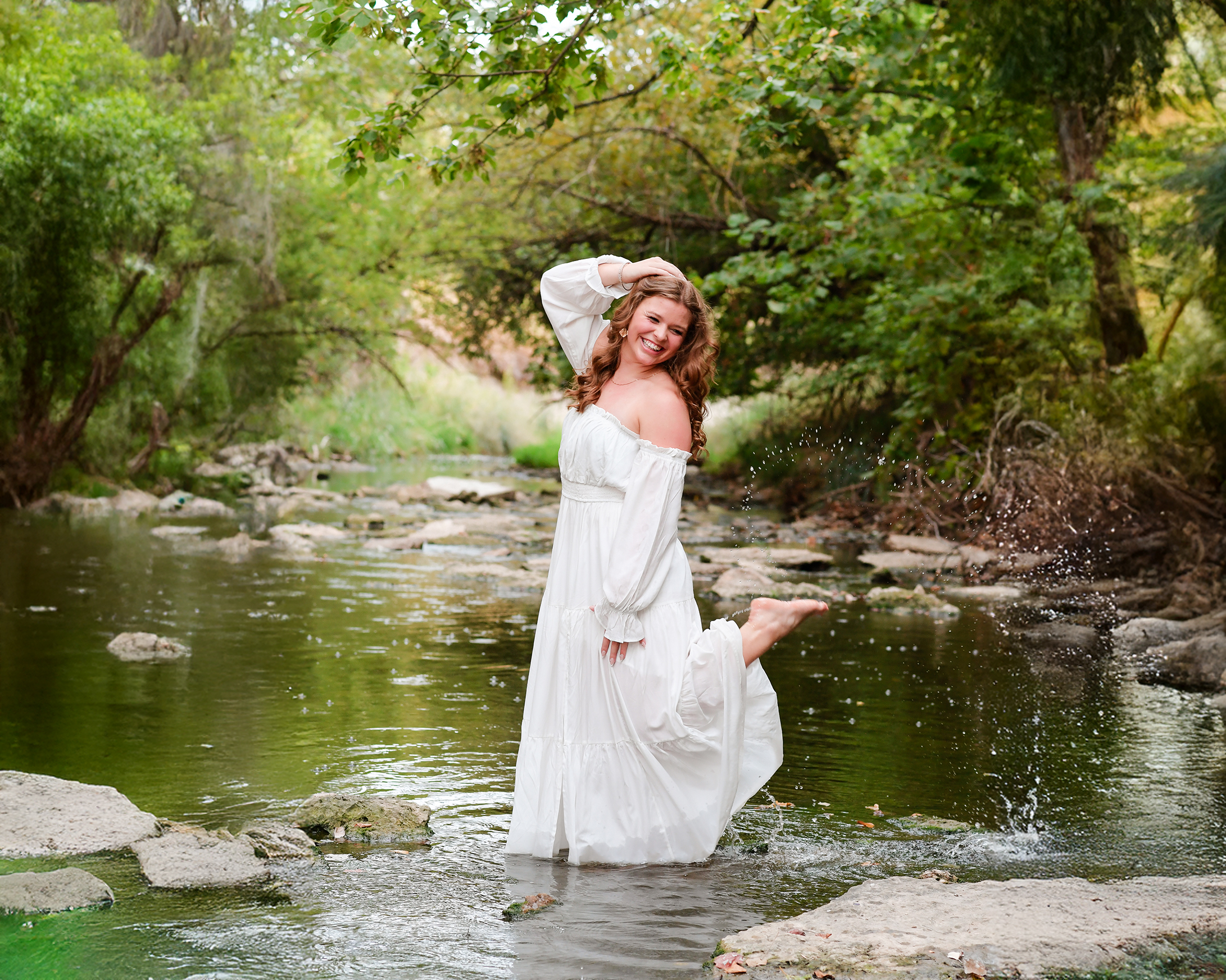 Shaylin Rose, Poolville High School senior, posing outdoors during her senior photography session in North Texas